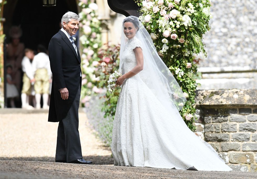 ENGLEFIELD GREEN, ENGLAND - MAY 20:  Pippa Middleton and her father Michael Middleton arrive at the wedding of Pippa Middleton and James Matthews at St Mark's Church on May 20, 2017 in Englefield Green, England.  (Photo by Samir Hussein/Samir Hussein/WireImage)