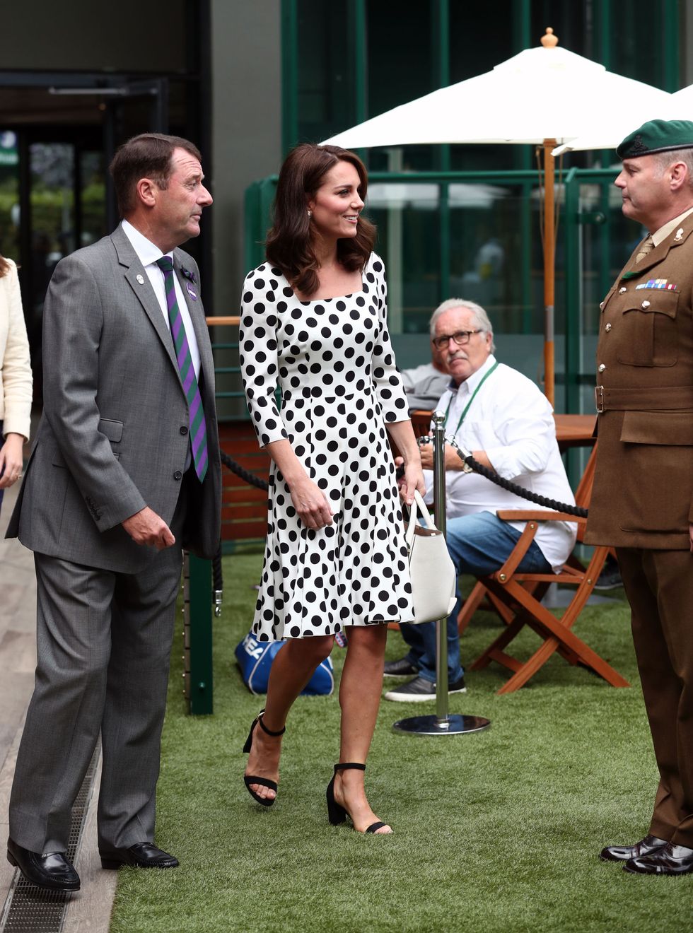 LONDON, UNITED KINGDOM - JULY 3:  Catherine, Duchess of Cambridge, Patron of the All England Lawn Tennis and Croquet Club (AELTC) with AELTC Chairman Philip Brook (L) as she meets servicemen and women on day one of the Wimbledon Championships at The All England Lawn Tennis and Croquet Club, in Wimbledon on July 3, 2017 in London, England.  (Photo by Gareth Fuller - WPA Pool/Getty Images)
