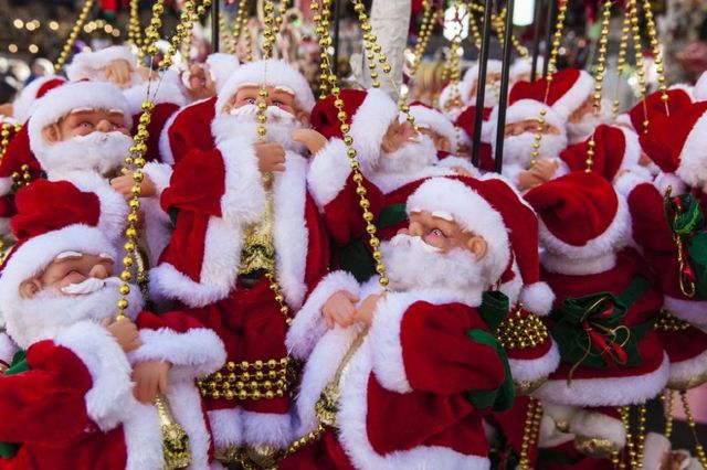 Santa claus, Christmas, Tradition, Christmas eve, Event, Fictional character, Christmas ornament, Holiday, Christmas decoration, 