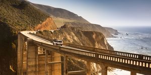 Coast, Sky, Cliff, Sea, Bridge, Terrain, Infrastructure, Road, Coastal and oceanic landforms, Architecture, 