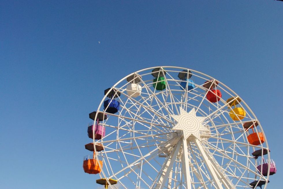 Ferris wheel, Tourist attraction, Wheel, Amusement park, Sky, Amusement ride, Fair, Recreation, Fun, Automotive wheel system, 
