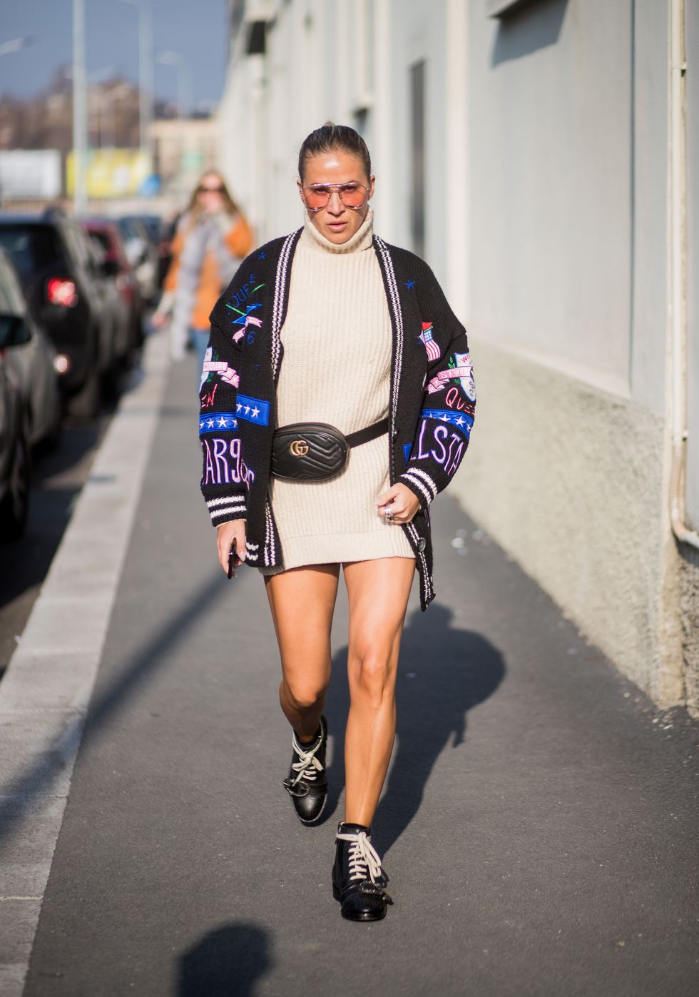 MILAN, ITALY - JANUARY 14: A guest wearing cardigan, Gucci belt, creme turtleneck knit is seen outside DSquared2 during Milan Men's Fashion Week Fall/Winter 2018/19 on January 14, 2018 in Milan, Italy. (Photo by Christian Vierig/Getty Images)