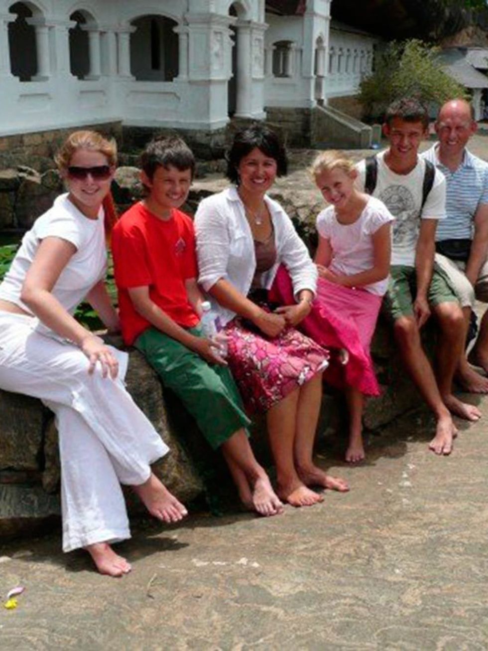 Charlotte Wallace.
 
Here I am with my Mum, Dad brothers and sister at a temple in Sri
Lanka. We went there to see where my grandmother grew up, as her
family are from there. We went to her old house, her local church,  and the disabled
children's home my