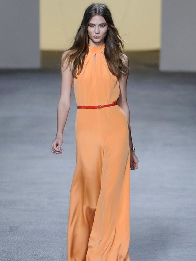 <p>Which of course we all are...</p><p>Bright sunny colours like tangerine and sunflower yellow were used on halterneck jumpsuits (did we mention the jumpsuit was back?), and leather button-down dresses. A brocade was used on sporty blouson jackets and ci