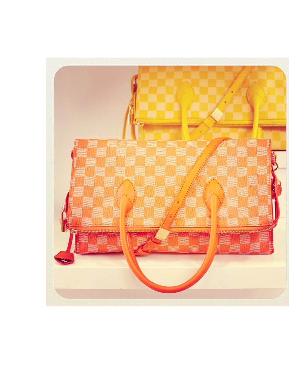 <p>Louis Vuitton Mobile Damier Couleur in Mimosa and Piment  £1,460</p>