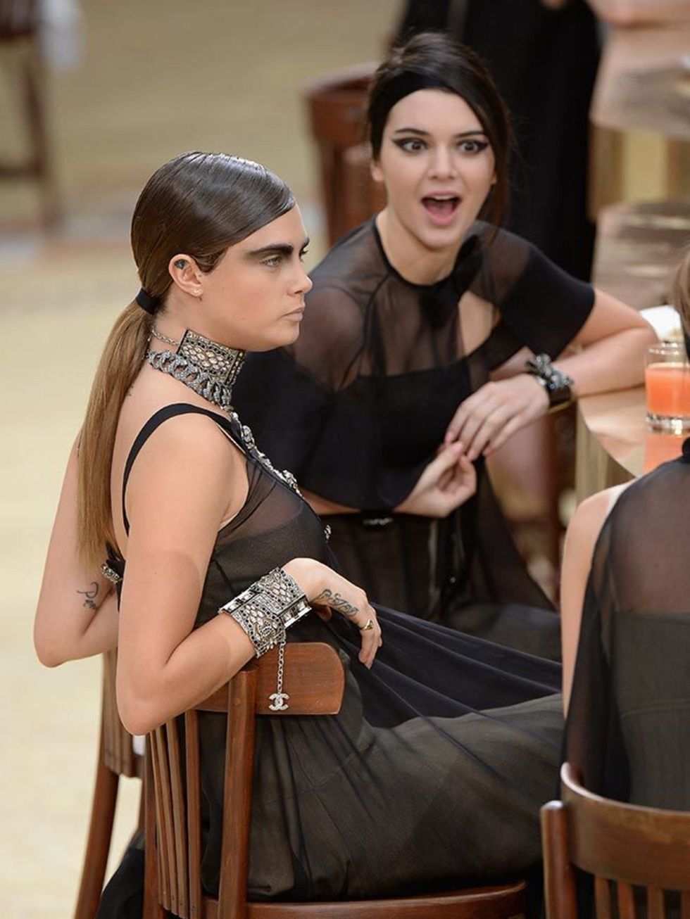 Kendall and bff Cara Delevingne during the Chanel show, March 2015.