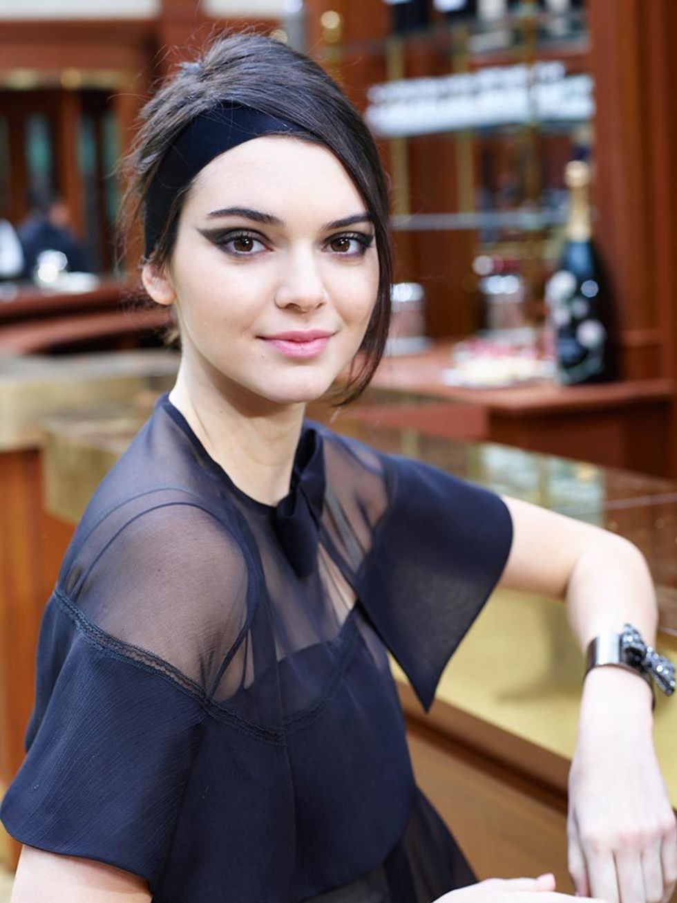 Kendall sports a dramatic eye flick, courtesy of Tom Pecheux, during the Chanel show, March 2015.