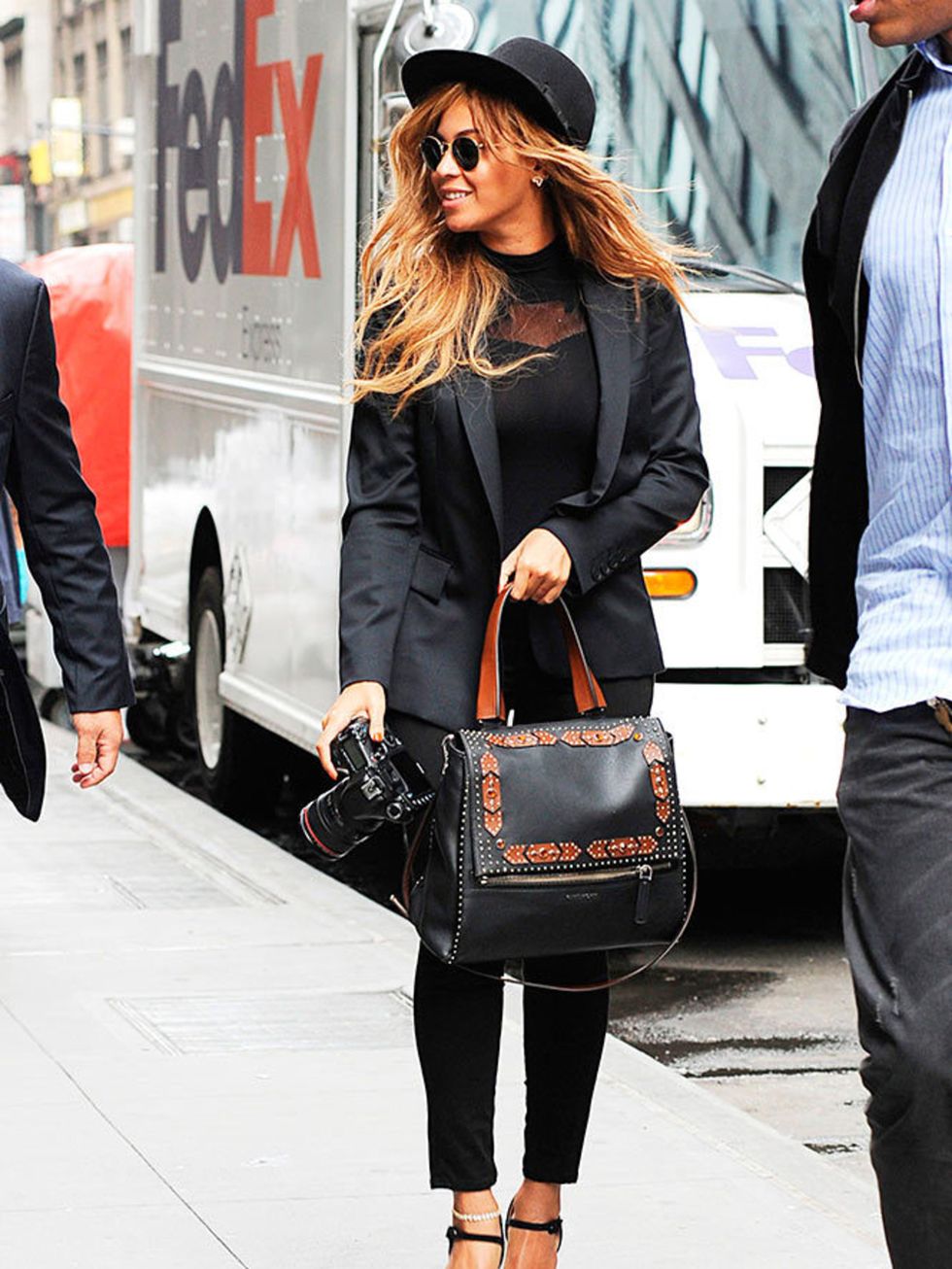 Beyonce steps out in New York wearing an all black outfit and carrying her new Givenchy bag, July 2015.