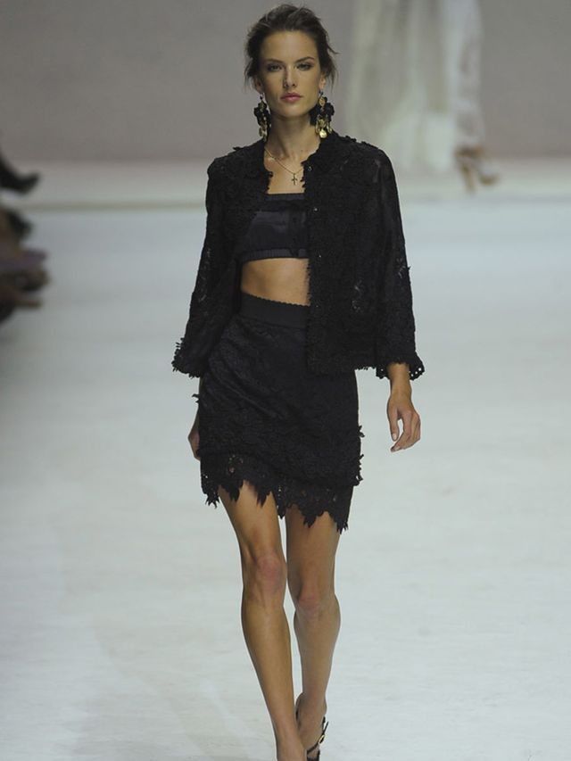 <p>Last season we saw a troupe of Dolce figures in black, championing the houses signature blazer and big knickers. This time, they reversed the aesthetic to show the pure white bride in lace embroidered full-length dresses, baby dolls and cami/shorts lo