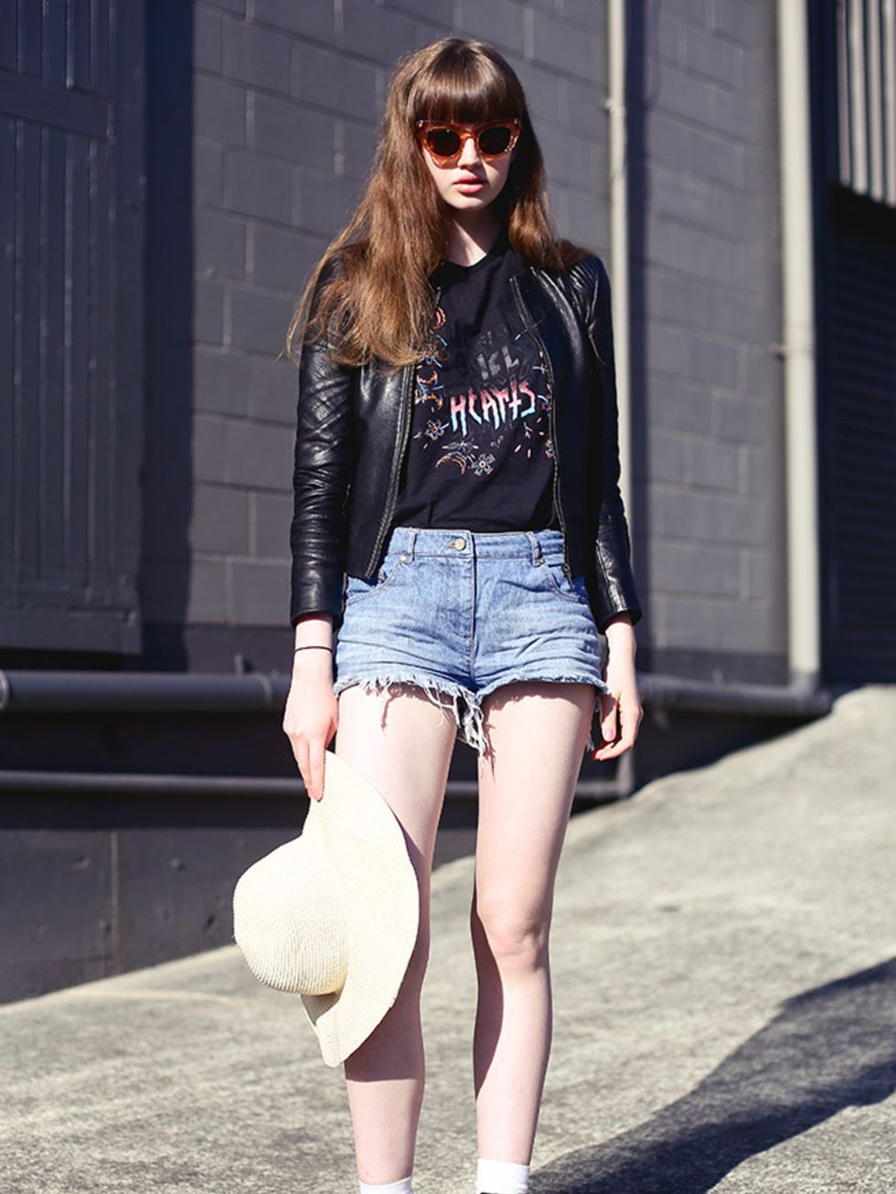 <p>Amberley wears vintage sunglasses, an ASOS jacket, vintage shirt and Topshop shorts and hat.</p>