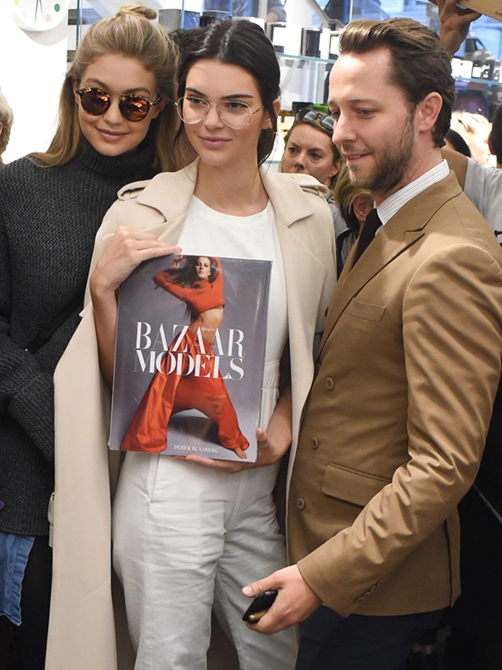 Gigi Hadid, Kendall Jenner and Derek Blasberg attend an event at the Colette store, Paris.