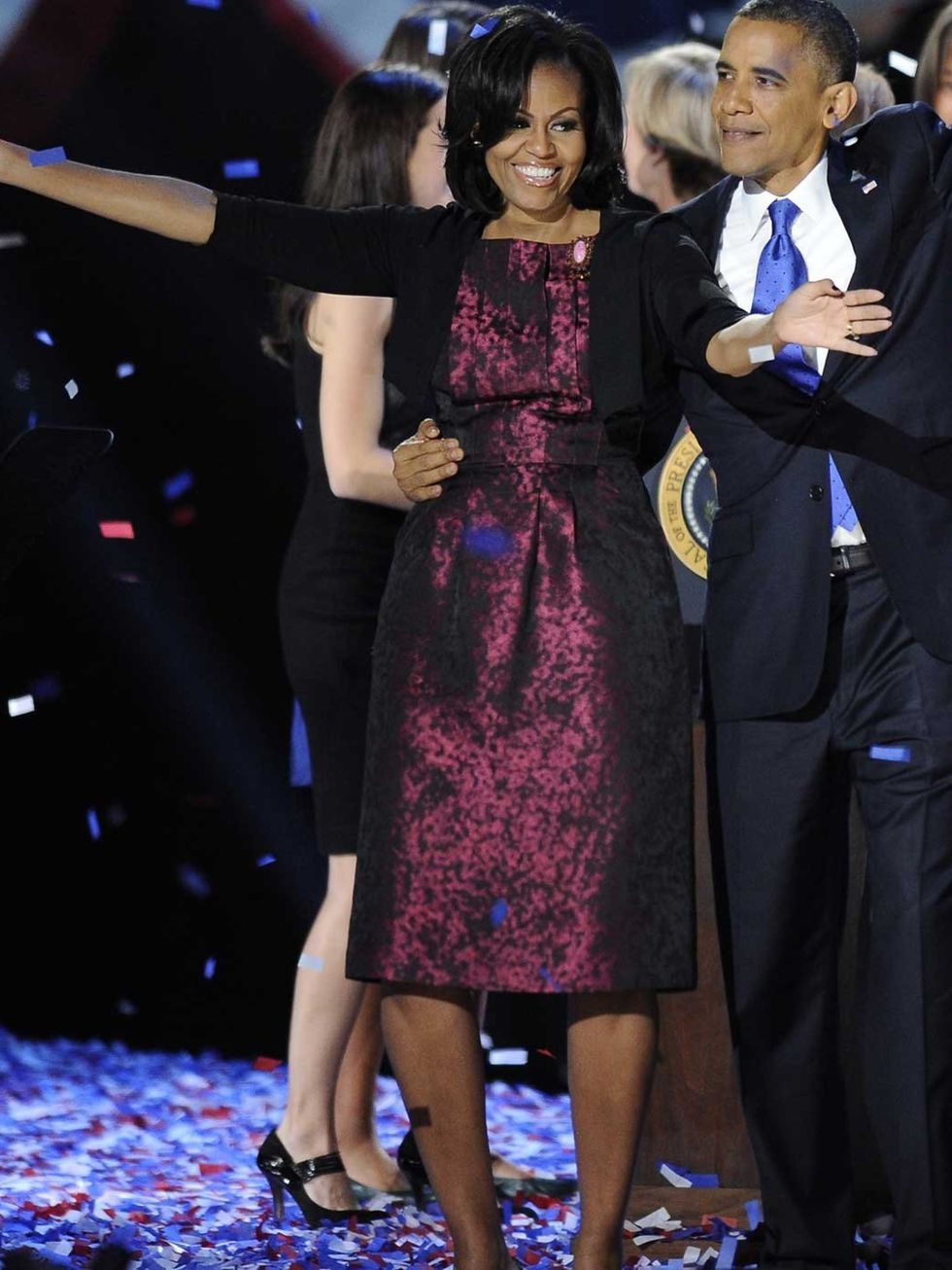 <p>Michelle Obama celebrates President Obama's victory in Michael Kors</p>