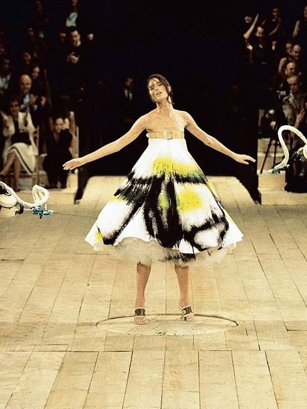 <p><strong>3) The spray-painted dress.</strong></p>

<p>No 13, s/s 1999  must be one of McQueens greatest early shows, featuring the model Shalom Harlow being spray-painted by futuristic car robots as she turned on a revolving floor.</p>

<p>GIVE ME TI