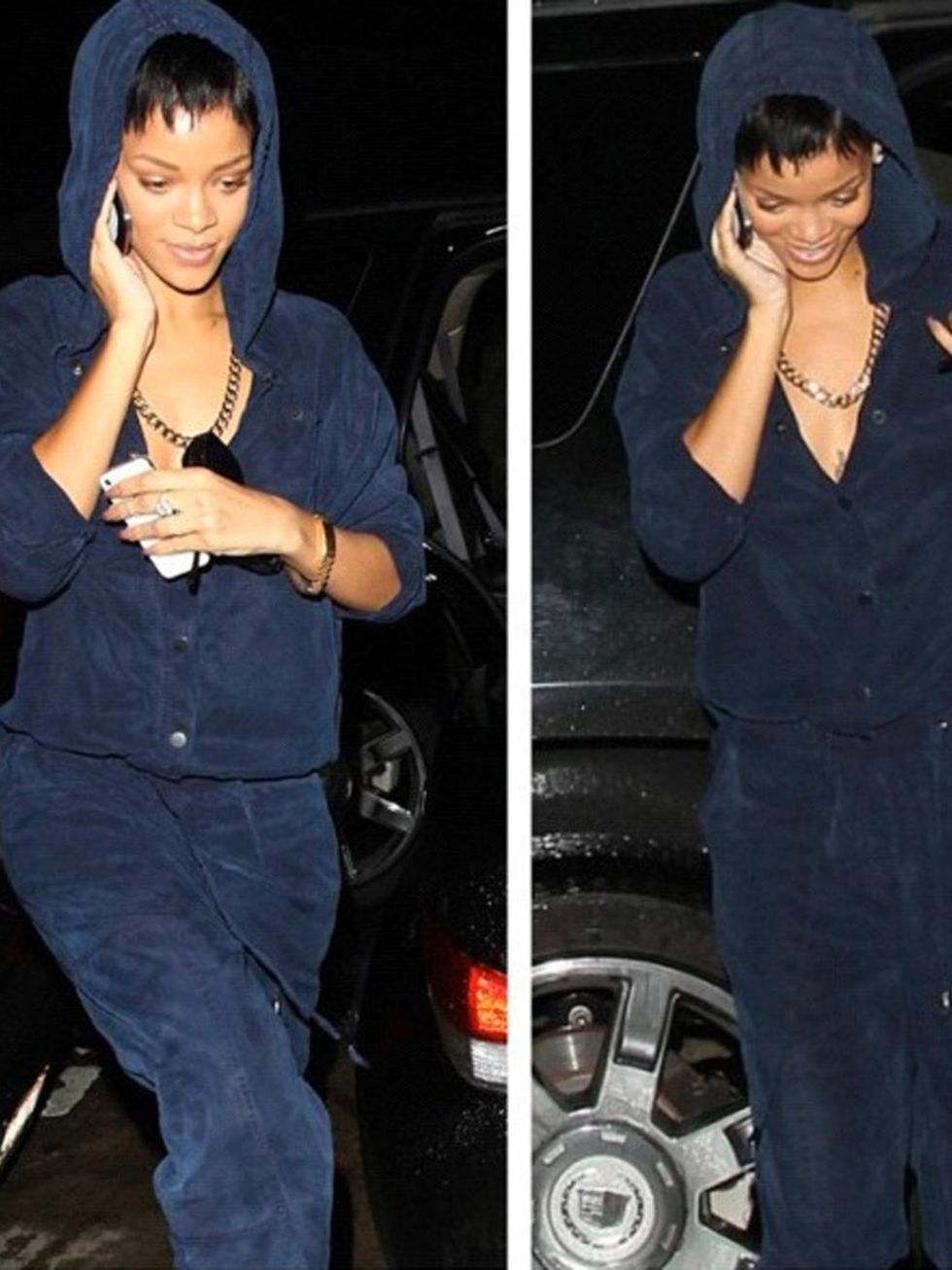 <p>Rihanna wears a navy jumpsuit from her own collaboration with River Island.</p>