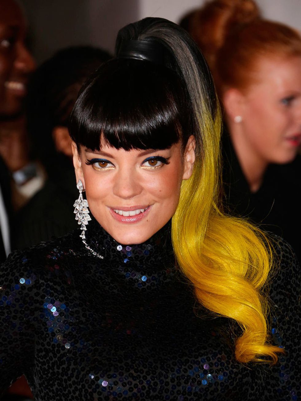 <p>Lily Allen opted for the same high ponytail as she wore at the <a href="http://www.elleuk.com/elle-style-awards/red-carpet/elle-style-awards-2014-red-carpet-celebrities-and-designers">ELLE Style Awards</a> this week, only at the BRIT Awards she added c