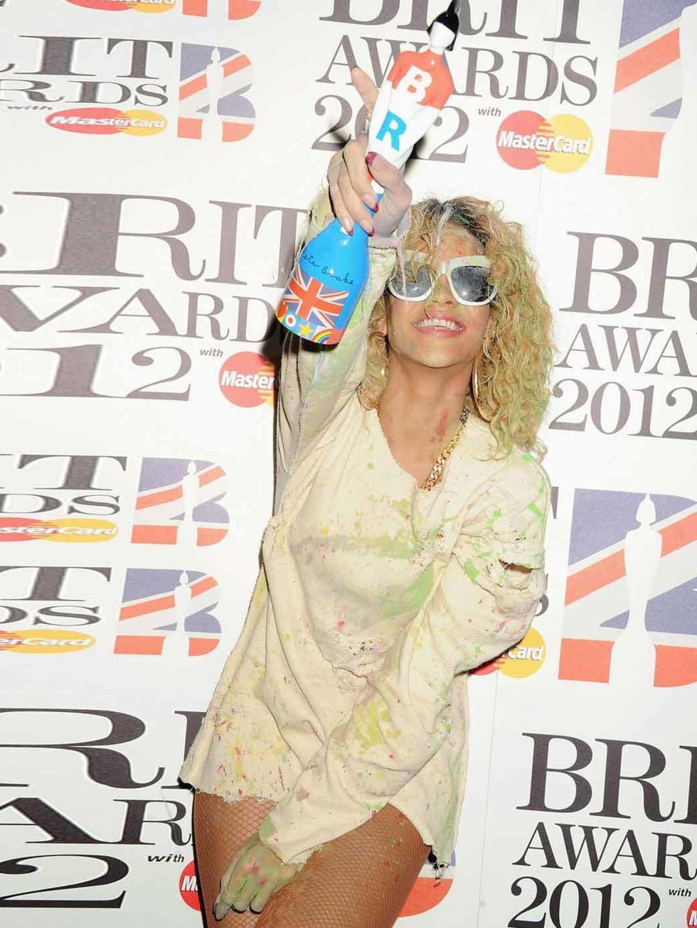 <p><a href="http://www.elleuk.com/star-style/celebrity-style-files/rihanna">Rihanna</a> clutches her award for International Female Solo Artist at the Brit Awards 2012</p>