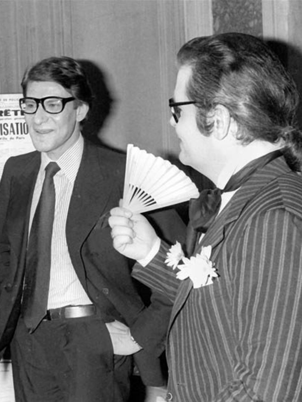 <p>An early-career photograph of Yves Saint Laurent and Karl Lagerfeld</p>