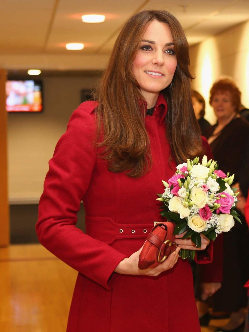 <p><a href="http://www.elleuk.com/star-style/celebrity-style-files/kate-middleton">Kate Middleton</a> wears a red LK Bennett coat with a matching <a href="http://www.elleuk.com/catwalk/designer-a-z/gucci/spring-summer-2013">Gucci</a> 1921 collection clutc
