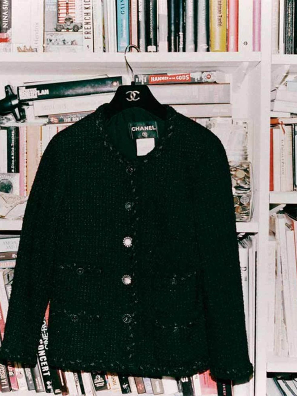 <p>Her essential black Chanel jacket</p>