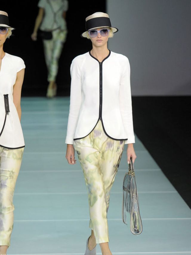 <p>The first half of the collection stuck firmly to black and white, to such and extent that pairs of models took to the runway wearing the same looks but in reverse - a pair of black silk trousers with white trim was mirrored by a black pair with white t