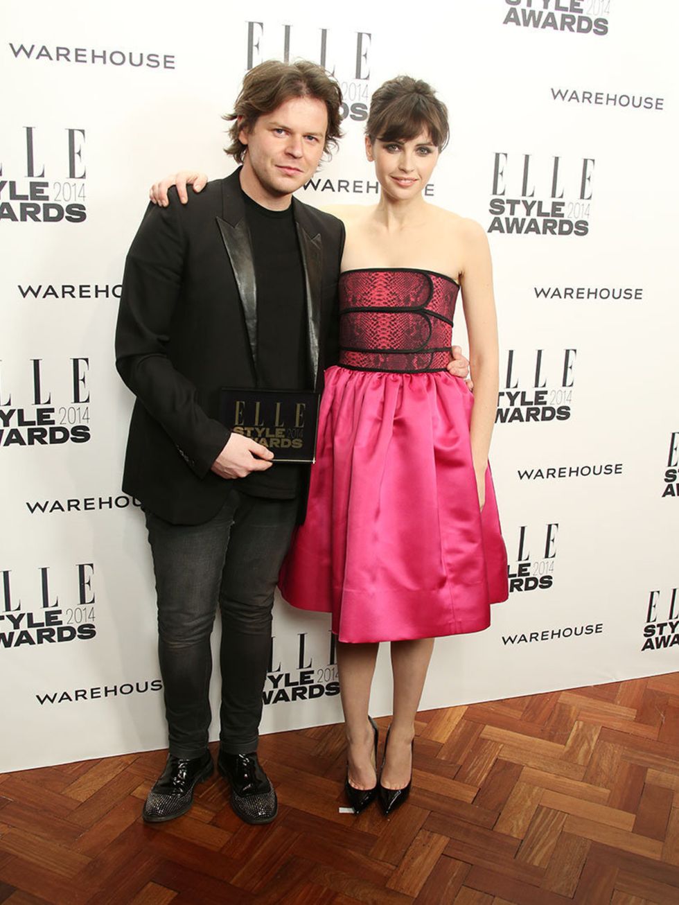 <p>British Designer of the Year:</p><p>Christopher Kane, with presenter Felicity Jones</p>