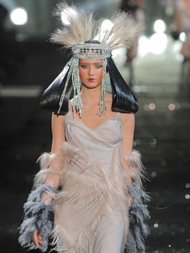 <p>Glitter rained down on the runway as warriors clad in voluminous brocade coats, bias-cut gowns, silk trousers and Mongolian fur and Fez hats. Being Galliano, this was worn all at once in the theatrical style that he is loved for. </p><p>Lace knickers p