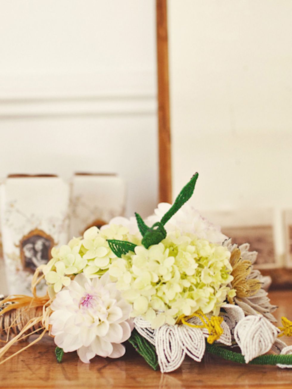<p>My bouquet was a mixture of vintage beaded lilies (sourced from America on Etsy), and cream dahlias. We wanted all the flowers to be seasonal and home-grown and we were so lucky that our venue had a garden full of dahlias in all varieties and colours, 