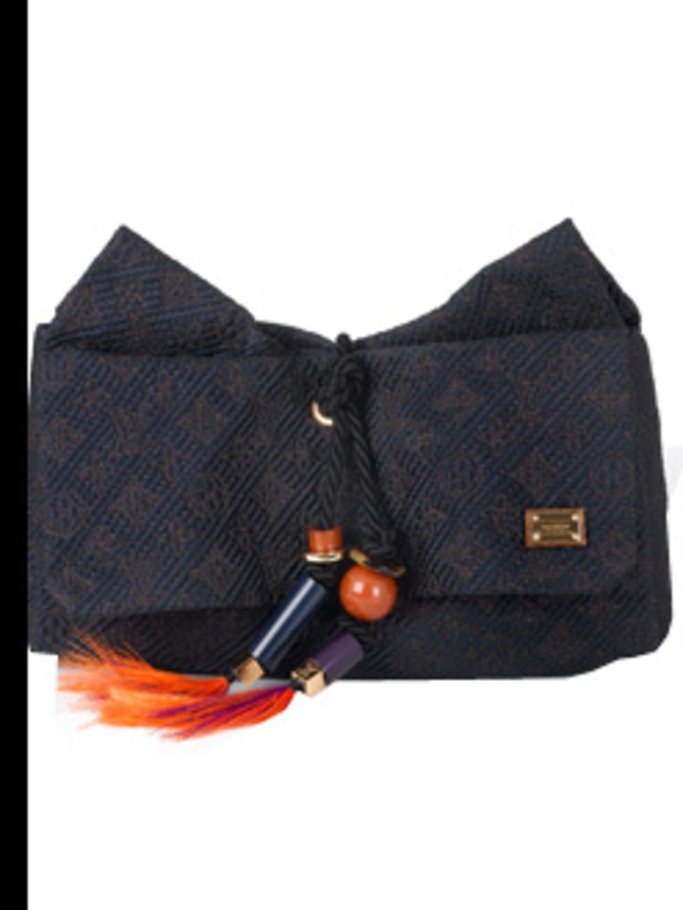 <p>Clutch, £1,790.00 by Louis Vuitton. For stockists call 0207 399 4050. 'If I cant pack enough to change my whole outfit every day then Ill change my handbags instead. The pattern and colour on this clutch are just enough to add colour to the sea of bl