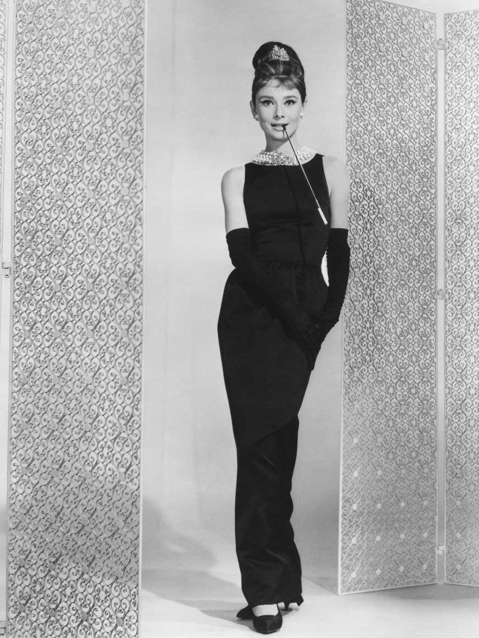 <p>Audrey Hepburn wears a Givenchy designed long black sleeveless cocktail dress in Breakfast At Tiffany's.</p>