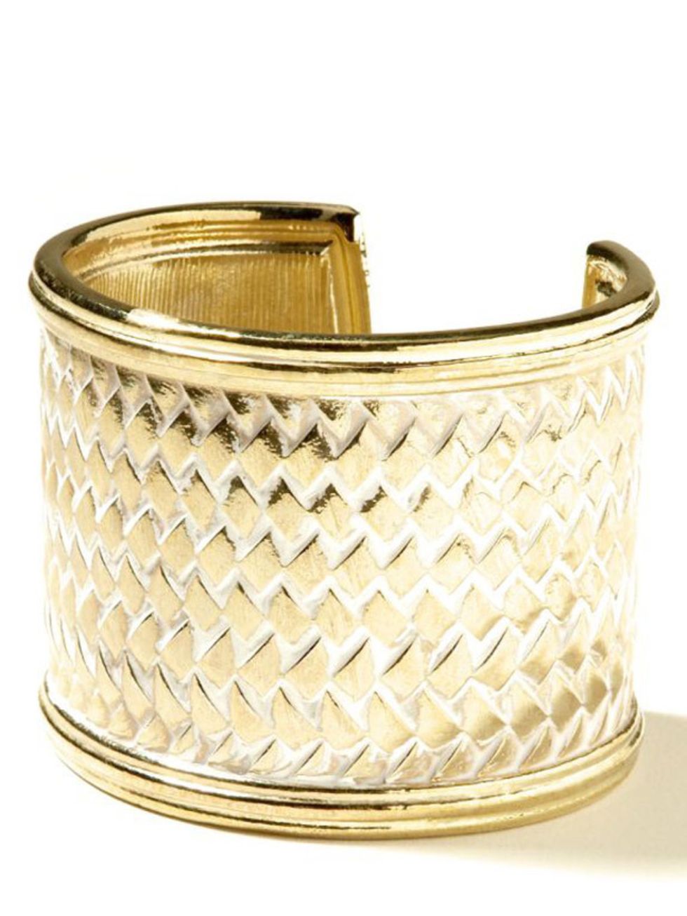 <p>Embossed gold cuff, £25, by Banana Republic (0207 758 3550)</p>