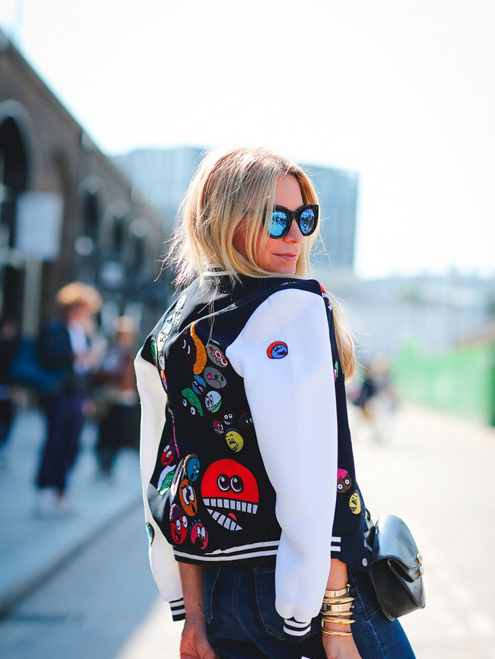 Jennifer Fisher wears Mira Mikati jacket, Valentino jeans, JW Anderson top, Celine shoes and Chloe bag