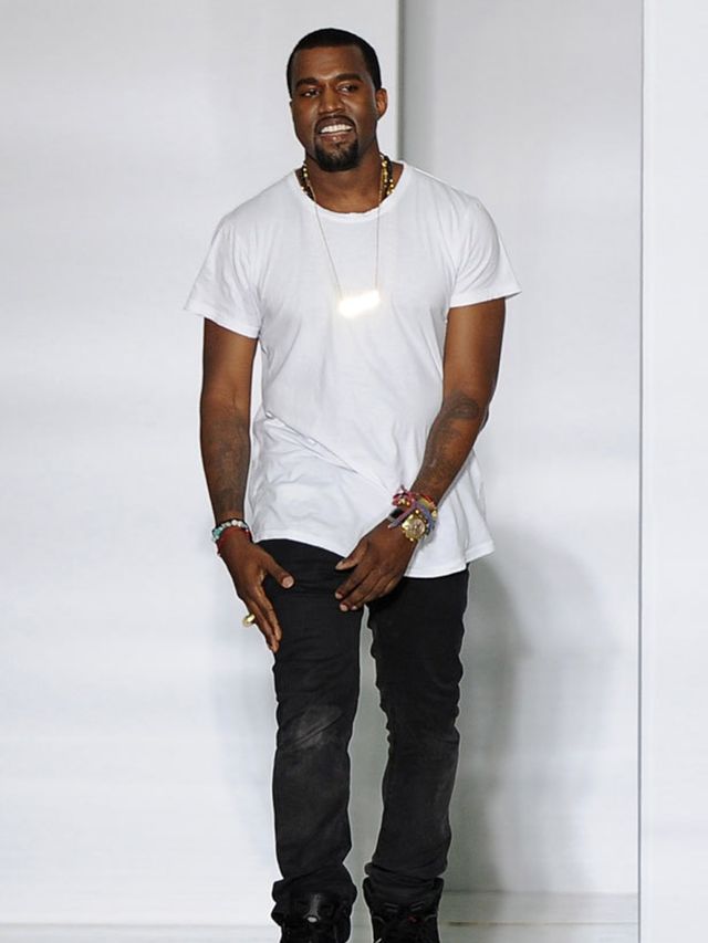 <p>Kanye West takes a bow at his fashion show</p>
