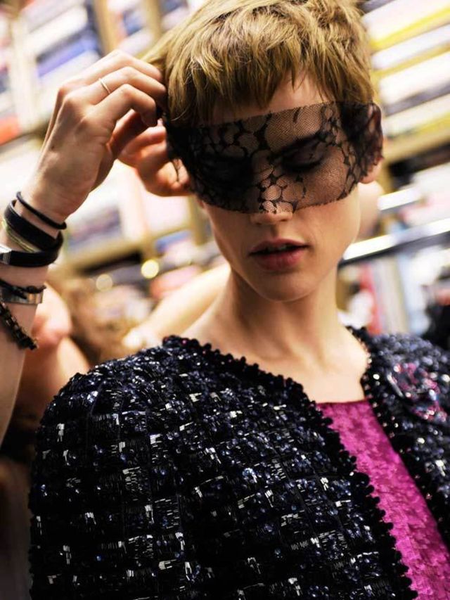 <p>A model wearing a lace mask at Chanel</p>