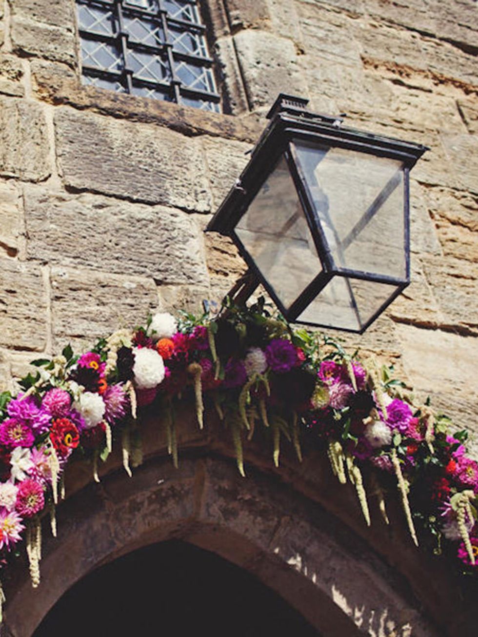 <p>We also found a local florist, <a href="http://www.thehomegrownflowercompany.co.uk" target="_blank">The Homegrown Flower Company</a>, to provide our floral arch, pew ends and to fill the church with seasonal dahlias and zinnias displayed in jam jars.</