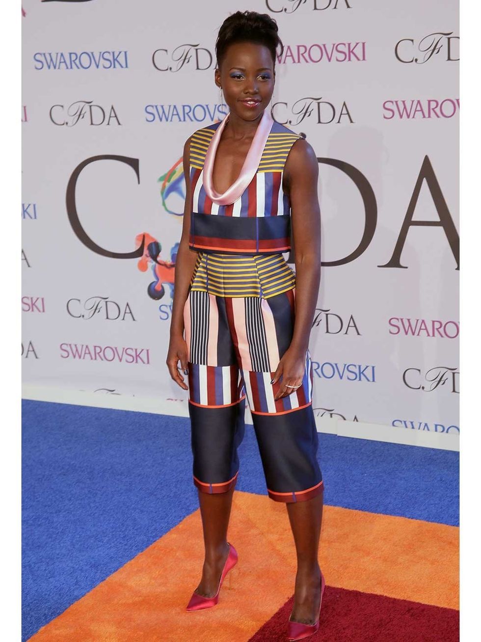 <p><a href="http://www.elleuk.com/star-style/celebrity-style-files/lupita-nyong-o-style-file-actress-miu-miu-chanel-couture">Lupita Nyong'o</a> attends the 2014 CFDA Fashion Awards wearing Suno.</p>