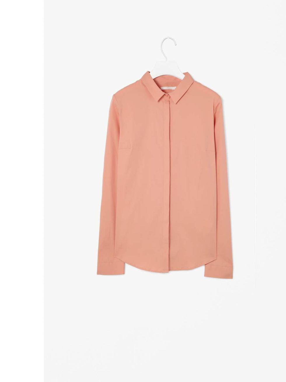 <p>The clean lines and cut of this shirt fit well with the ongoing minimal trend but the soft apricot keeps it feminine and pretty and would work well with blue denims or smarter navy tailored pieces. Slim Fit Shirt, £45 <a href="http://www.cosstores.com/