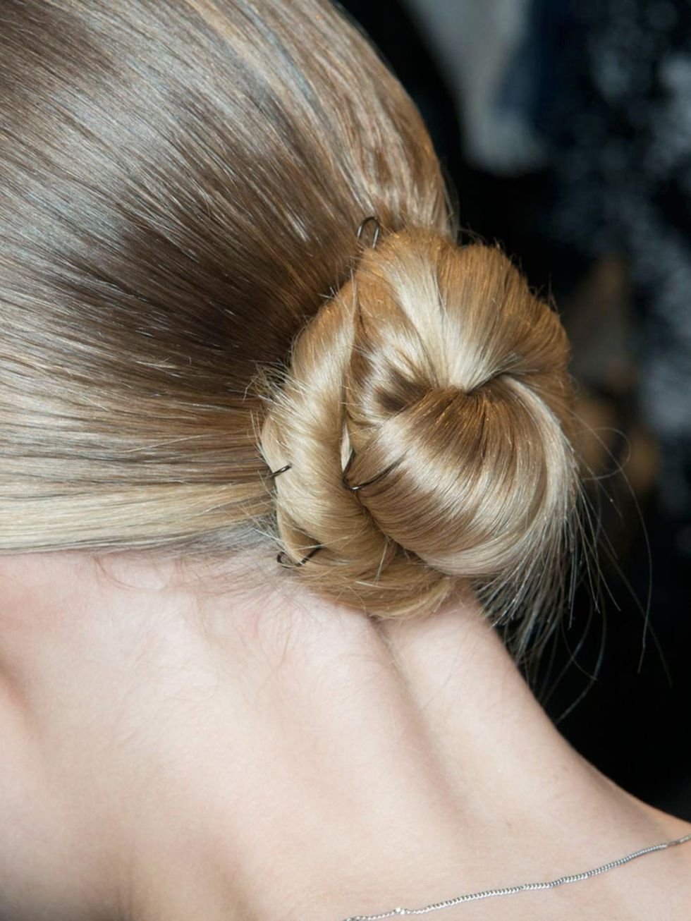 &lt;p&gt;We love this twisted bun at Akris. The pin detail adds extra intereet to an otherwise simple up-do.&lt;/p&gt;