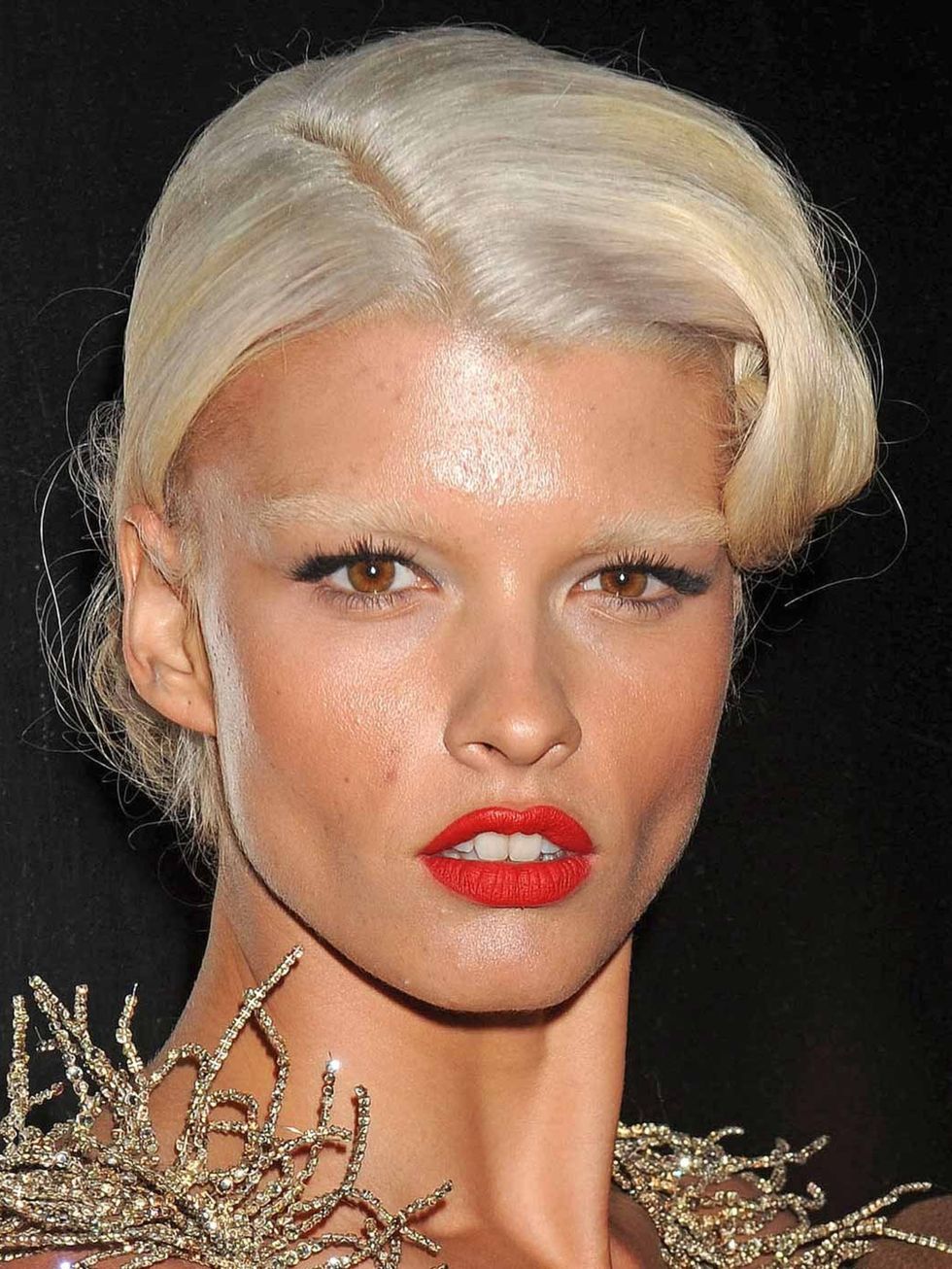 <p>Crystal Renn with platinum blonde hair and matching eyebrows</p>