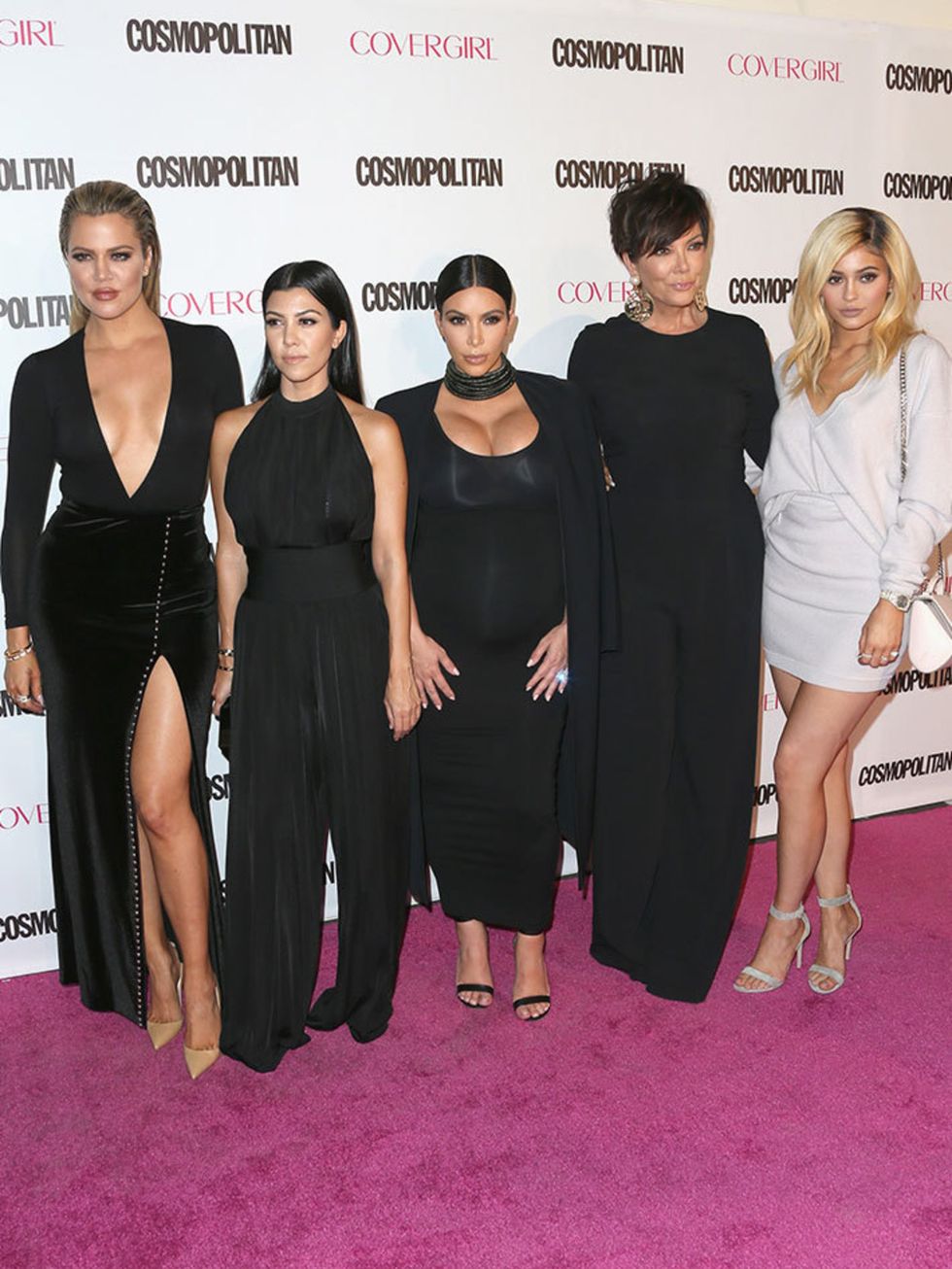 Kourtney and Kim Kardashian rep Balmain at Cosmopolitan's 50th birthday party. Kourtney opts for a current collection black jumpsuit, and Kim accessorises with a chunky Balmain necklace.