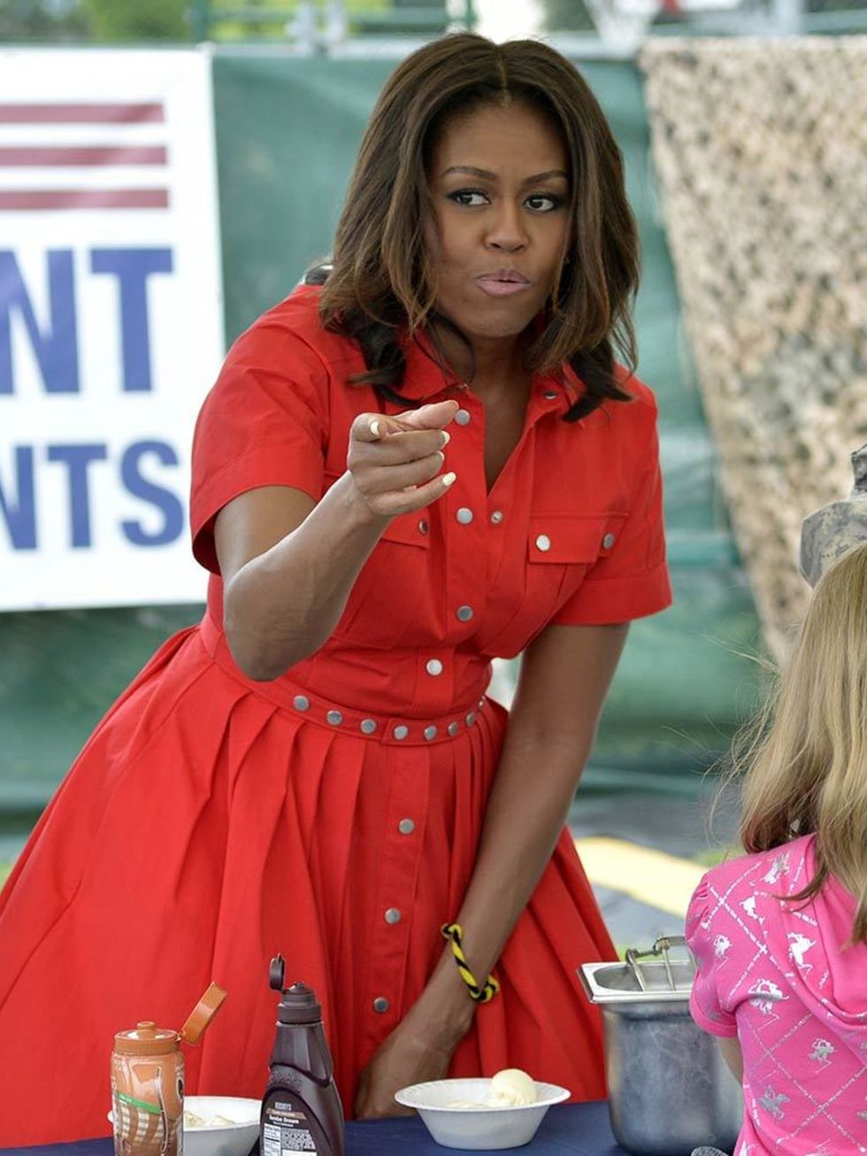 Michelle Obama distributes food to people at the United States and Nato military base in Aviano, Italy, June 2015.