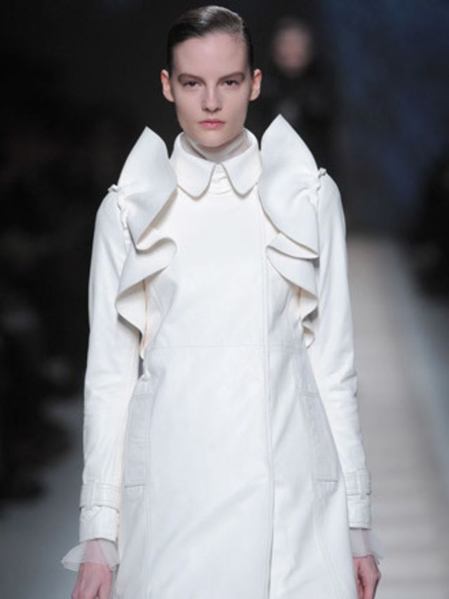 <p>There were nude jackets and coats with extravagantly ruffled fronts, chic white skirts with subtle folds, ruffled lace inserts, cascades of chiffon and sleek leather waves. All were interspersed with incredibly wearable slim tailored trousers, classic 