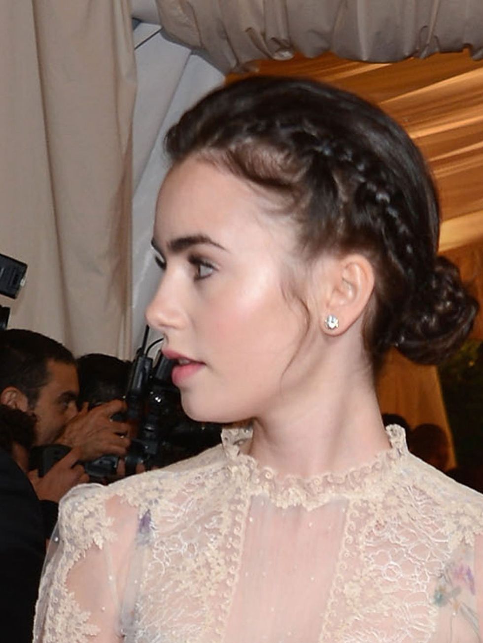 <p>Lily Collins with a plaited bun at the 2012 Met Ball</p>