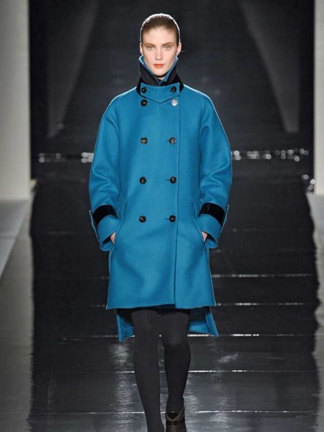 <p>As Milan threatens to snow tomorrow, flashes of wrestling the models to the ground for their cosy shearling coats and cocoon knits came to mind.</p><p>Heavy wool and tweed had fur panels and hoods, gilets came with funnel necks and black patent belts a
