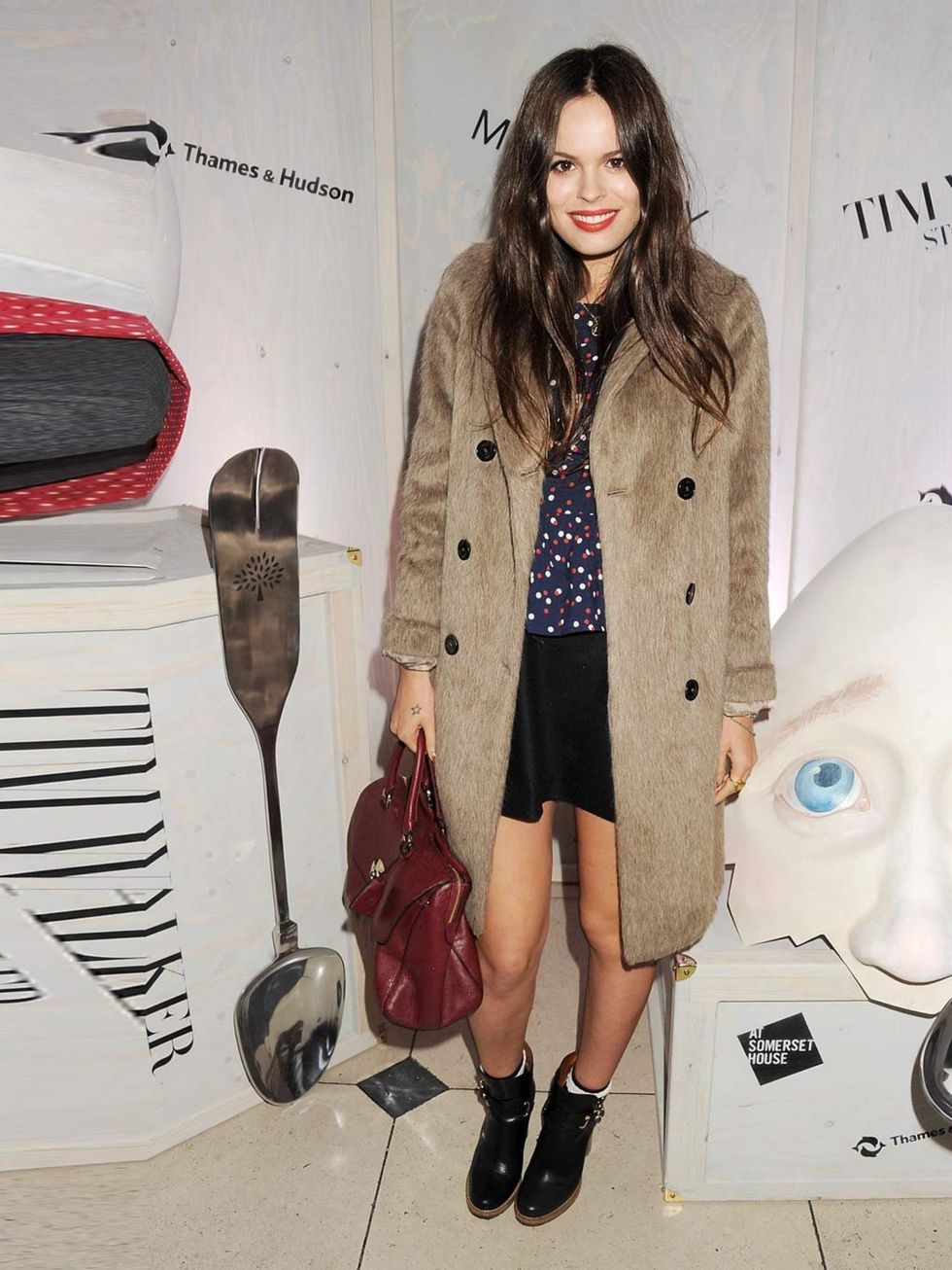 <p>Atlanta De Cadanet matches a Boyfriend Coat in truffle, Dorset High Heel Booties in black, with a Del Rey bag in black forest from the Mulberry AW12 collection at the Tim Walker Story Teller Exhibition opening party.</p>