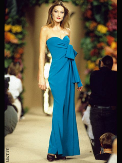 <p>Carla Bruni modelling YSL on the catwalk, 1996</p>