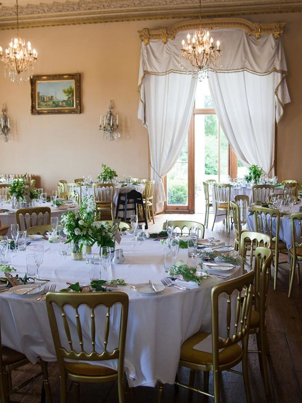 <p>The fact that the ballroom at <a href="http://www.orchardleigh.net" target="_blank">Orchardleigh House</a>  was so stunning made it easy to decorate, and the gold chairs and white table cloths tied in perfectly with out colour scheme. At each place set