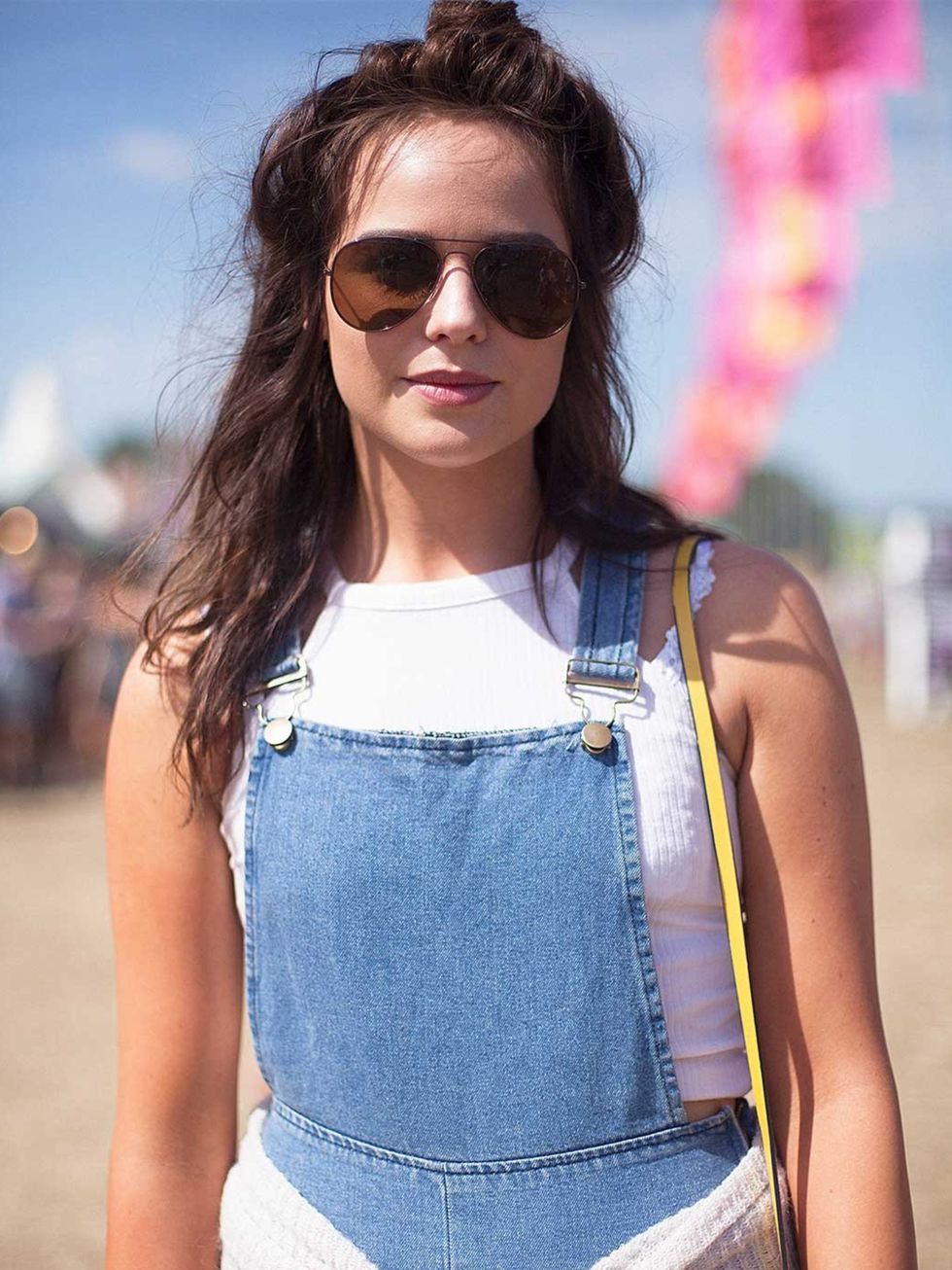 <p>Hannah Wright wears a River Island top, vintage dungarees and Tesco sunglasses.</p>