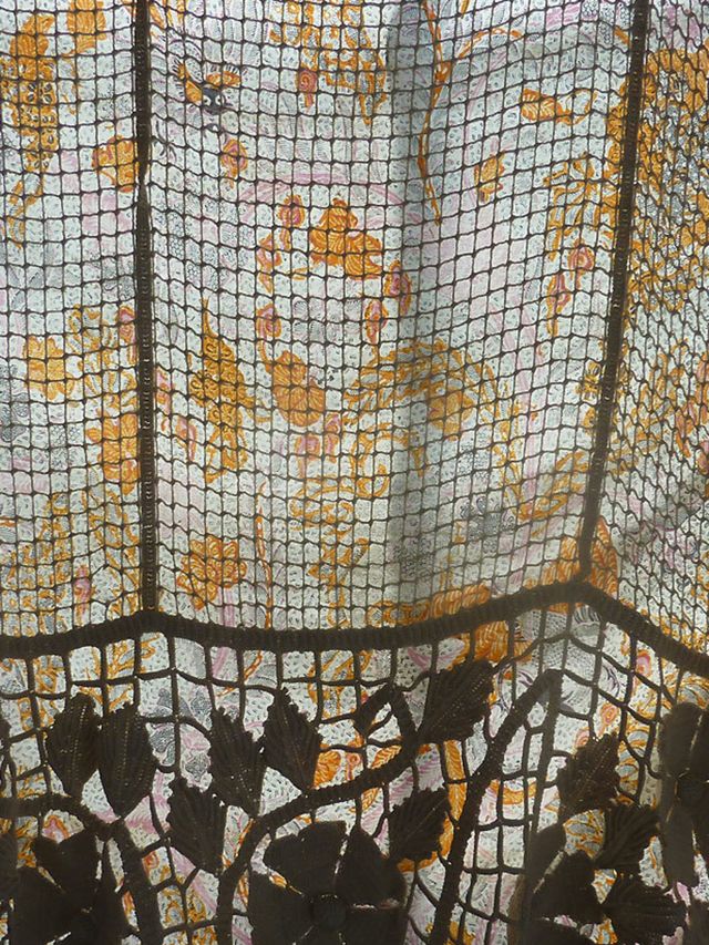 <p>A printed curtain with a lace curtain on top from Clements Ribeiro</p>