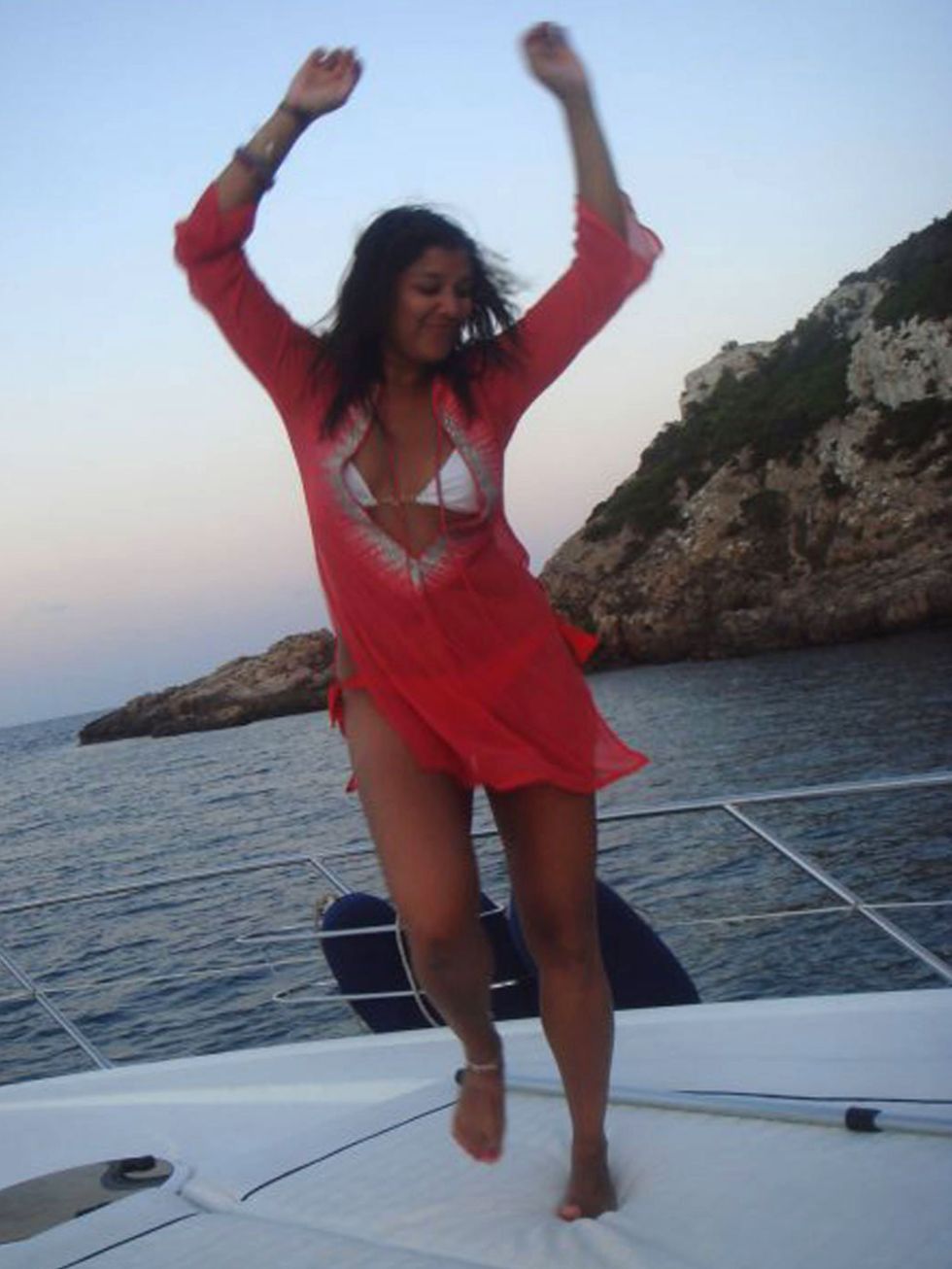 <p>Bonnie Rakhit dancing on a yacht in Ibiza, 2009</p>