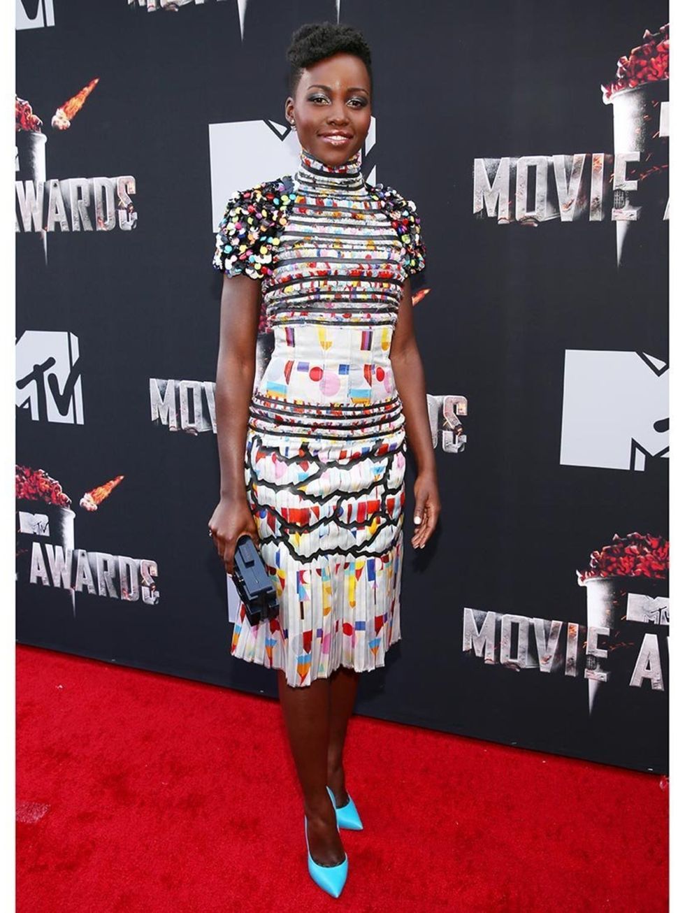 <p><a href="http://www.elleuk.com/star-style/celebrity-style-files/lupita-nyong-o-style-file-actress-miu-miu-chanel-couture">Lupita Nyong'o</a> wears a Chanel dress and Casadei shoes to the 2014 MTV Movie Awards.</p>